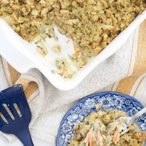 zucchini casserole recipe in baking dish with serving on a plate