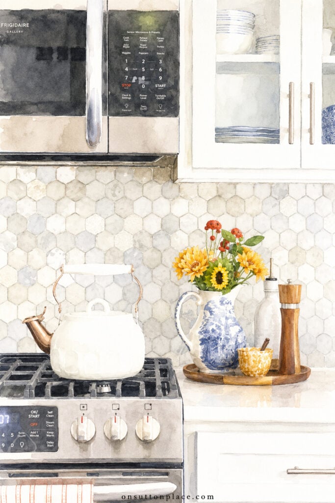 blue and white pitcher of fall flowers on kitchen counter with stove and microwave