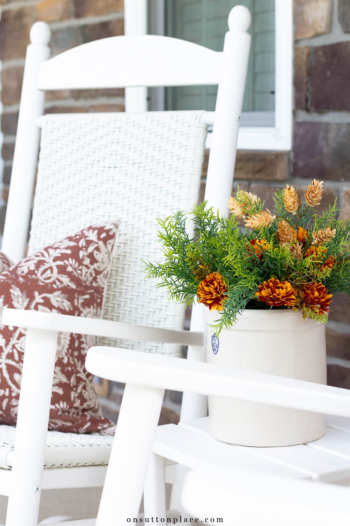 fall porch decorating ideas porch rocker with pillow and side table with crock