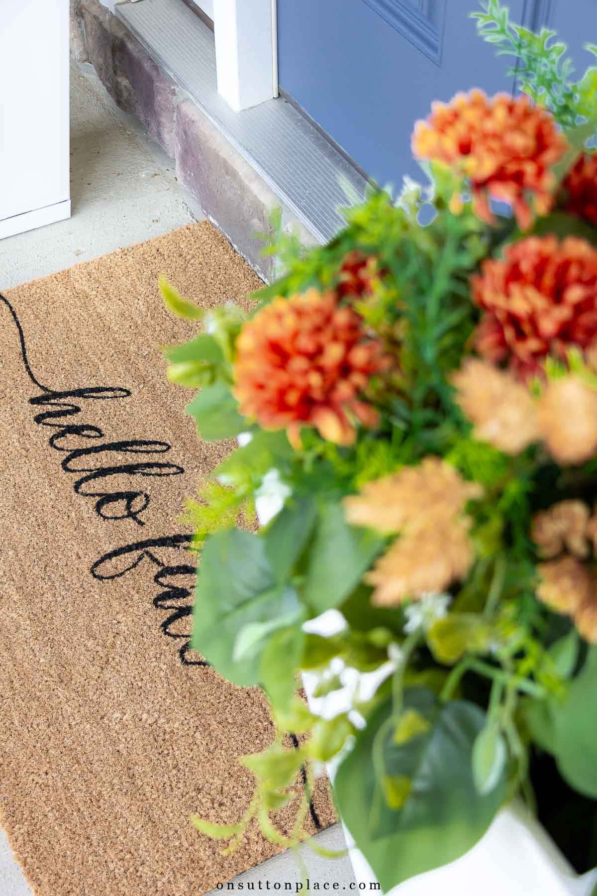 front porch decorating ideas doormat faux greenery with faux flowers in fall colors