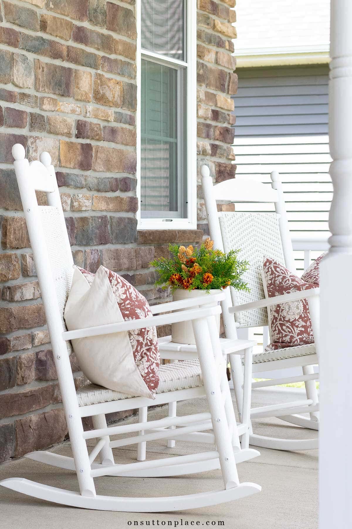 rockers on front porch with fall decor
