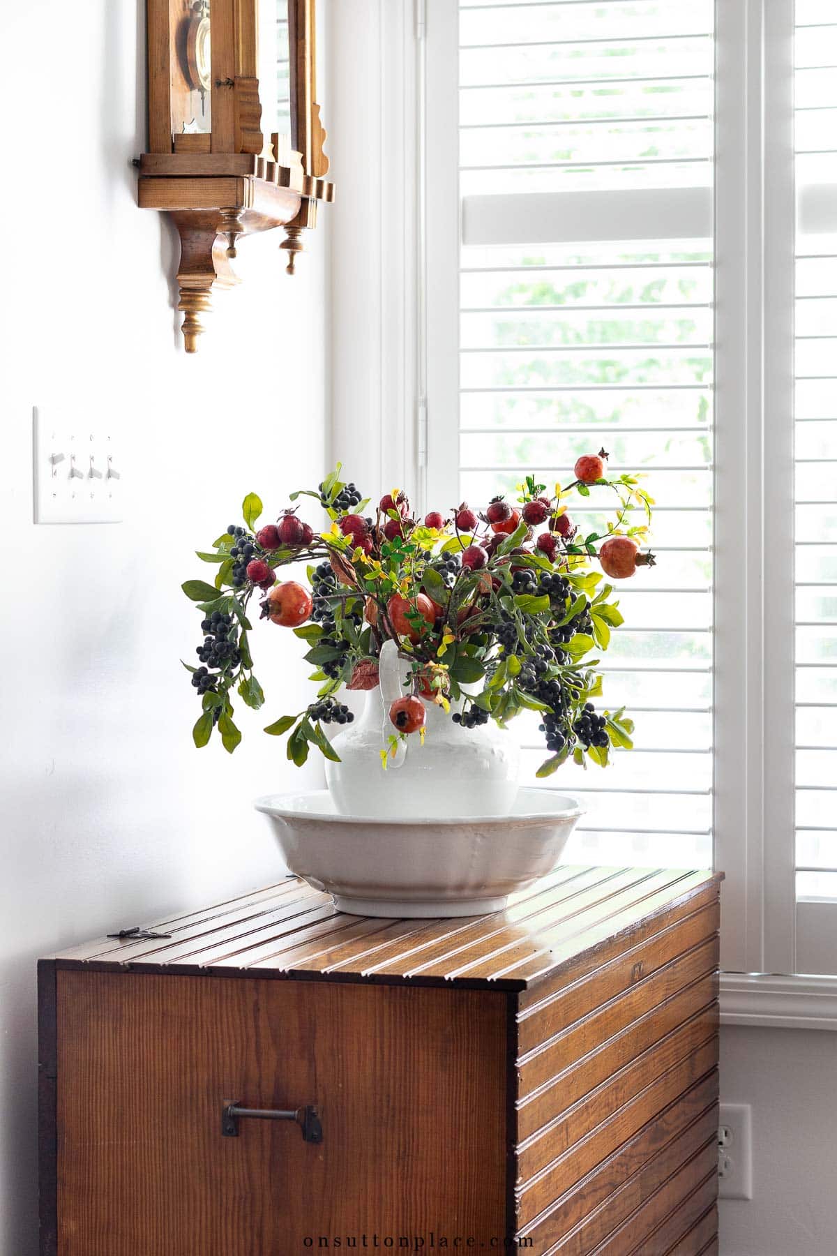 fall at home idea vintage pitcher and bowl filled with faux berry stems