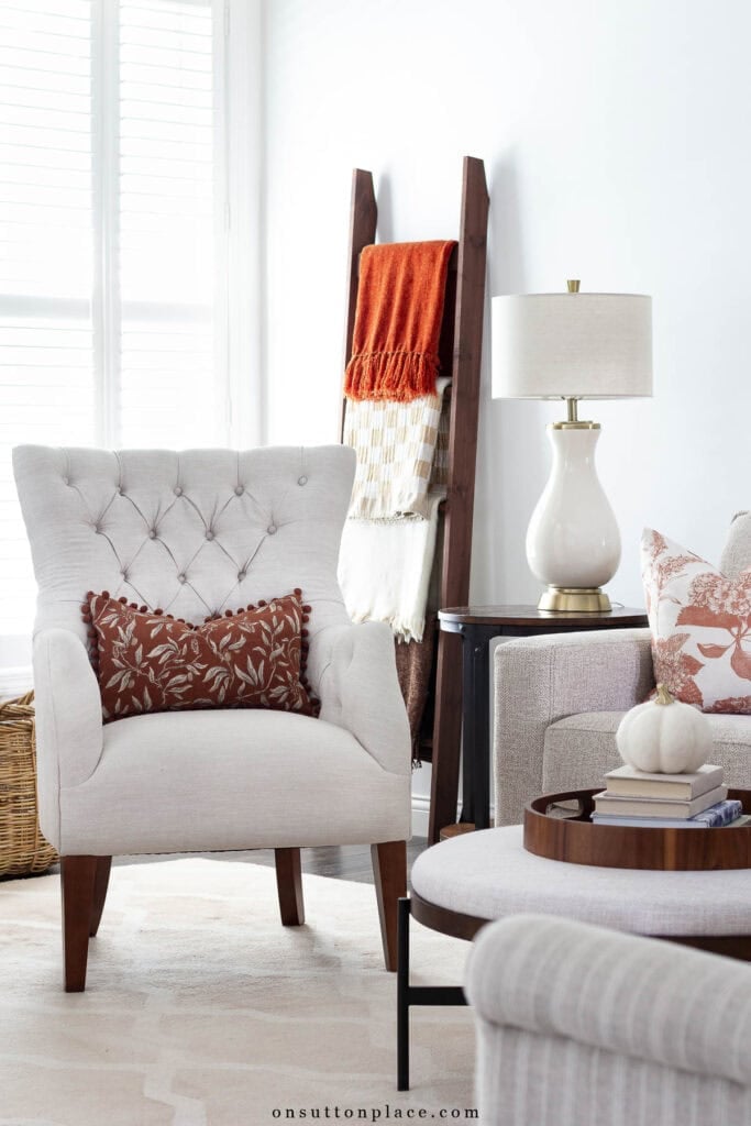fall at home ideas blanker ladder with colorful throws pillows in fall colors
