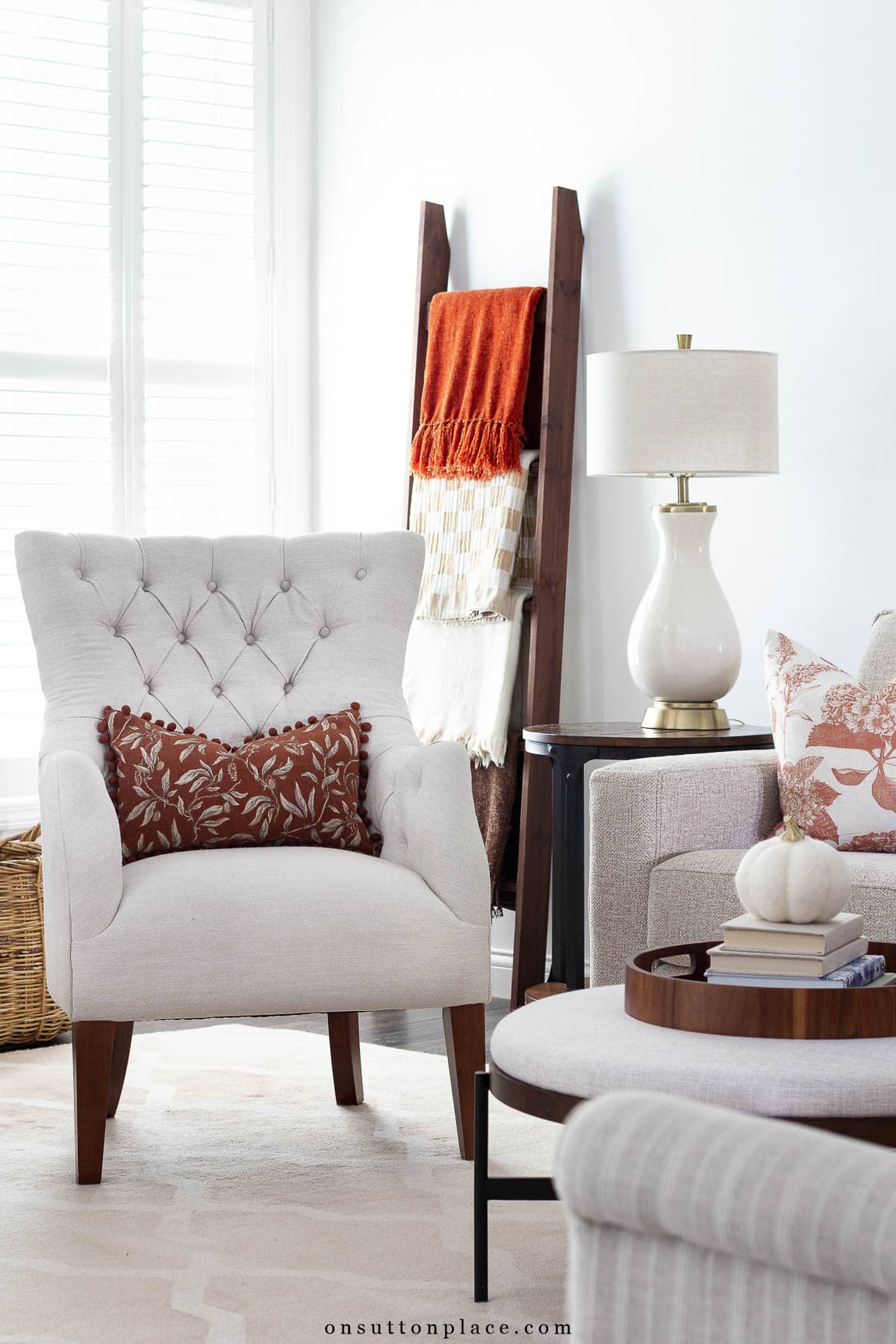 fall at home ideas blanker ladder with colorful throws pillows in fall colors
