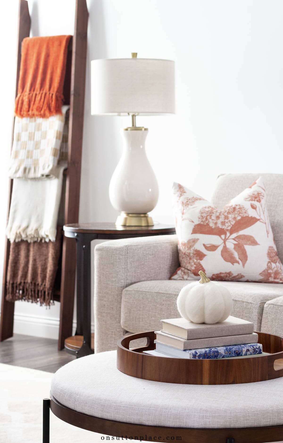 fall at home ideas upholstered coffe table with tray of books