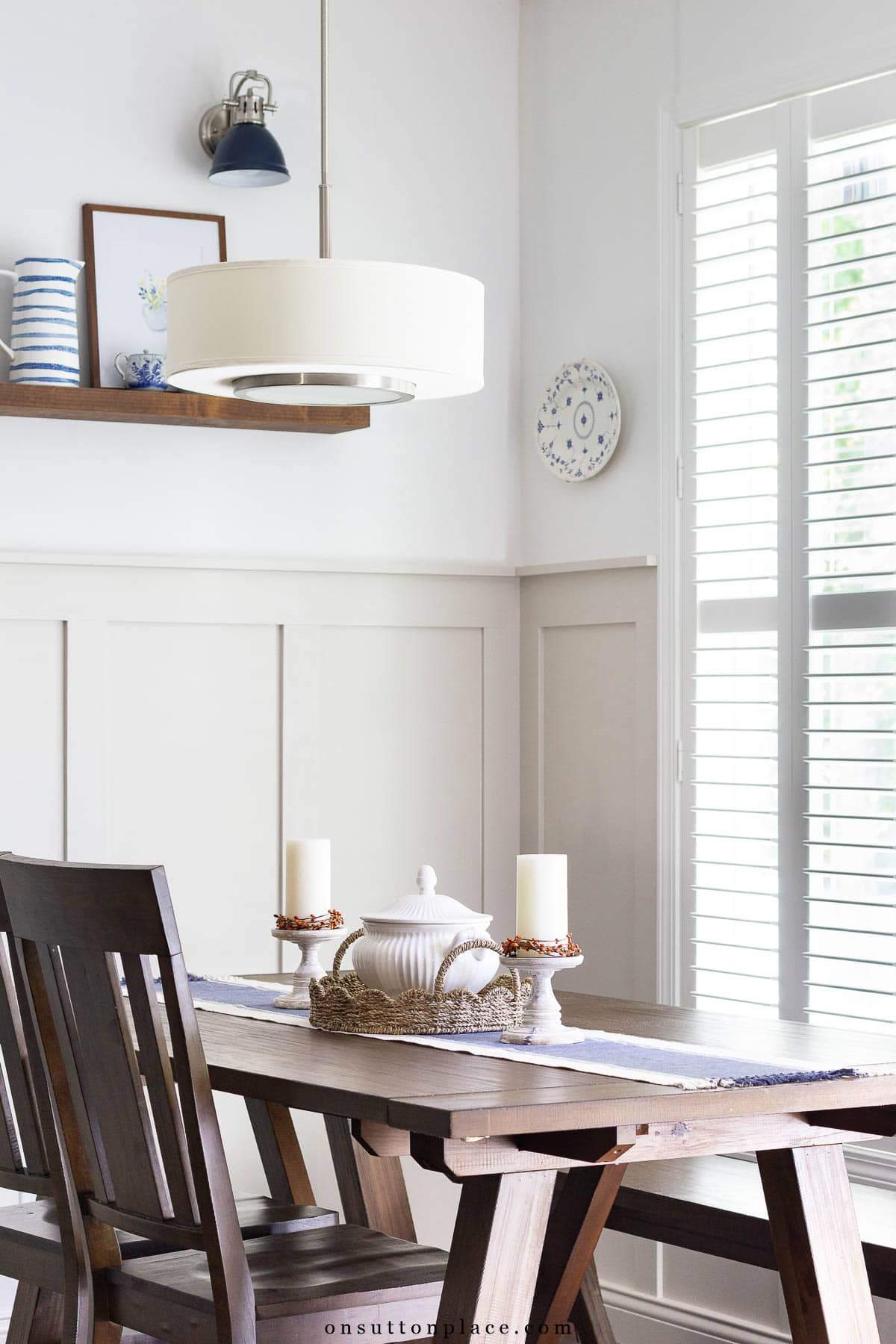 fall centerpiece idea in dining nook with board and batten