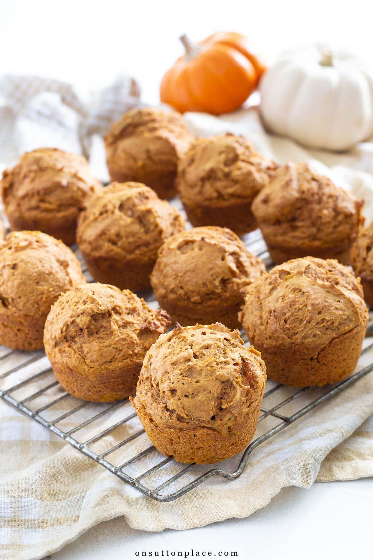 pumpkin spice muffins recipe with spice cake mix on cooling rack