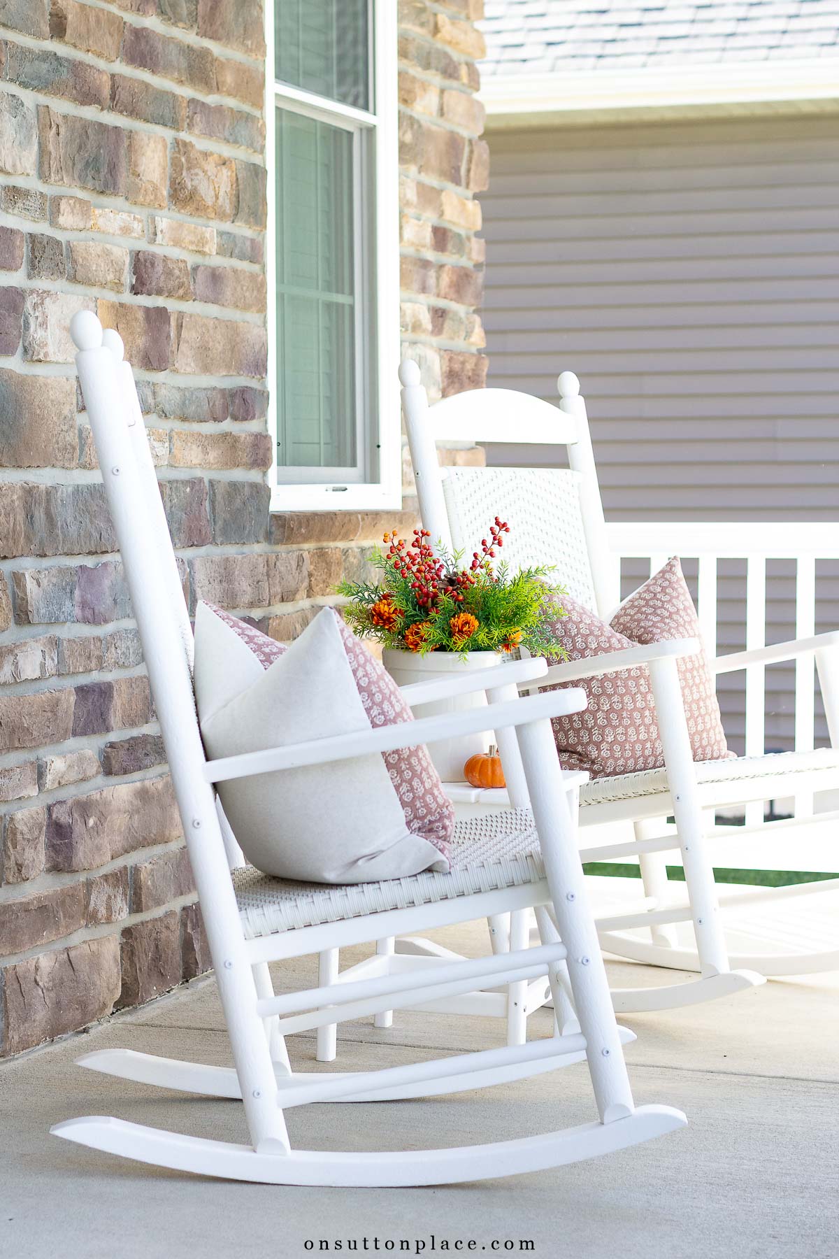 simple fall porch decor with white rockers